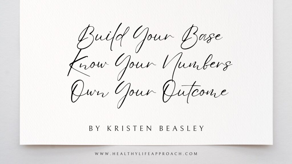 Elegant white card with handwritten-style black script text reading 'Build Your Base, Know Your Numbers, Own Your Outcome' by Kristen Beasley, with website www.healthylifeapproach.com at the bottom
