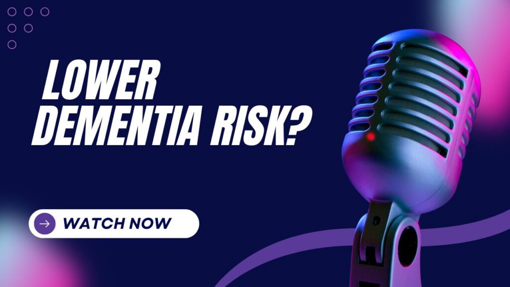 YouTube thumbnail with a dark navy blue background featuring bold white italic text reading "LOWER DEMENTIA RISK?" on the left side. On the right, a large vintage-style silver microphone is dramatically lit with purple and pink neon lighting, with a small red indicator light glowing on its body. A purple wavy line runs along the bottom, and a white rounded "WATCH NOW" button with a purple arrow icon sits in the bottom left corner. Decorative purple circle outlines appear in the top left corner, and a pink gradient glow accents the top right.
